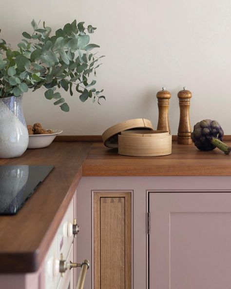 12+ Pink Paint Colors for Your Kitchen Cabinets that are Inspirational! Neutral Pink Kitchen Cabinets, Pink Cabinets Black Countertop, Earthy Pink Kitchen, Blush Cabinets Kitchen, Dusty Rose Cabinets, Blush Kitchen Cabinet, Pink Wood Kitchen, Mauve Cabinets Kitchen, Dark Pink Kitchen Cabinets