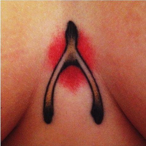 wishbone tattoo. different color behind it & different placement. Traditional Wishbone Tattoo, Wishbone Tattoo, Traditional Style Tattoo, Bone Tattoos, Tattoo Traditional, Nail Tattoo, Needle Art, Chest Tattoo, Body Mods