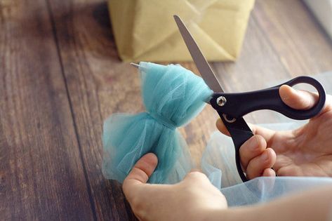 DIY Tulle Gift Bow Tutorial Tulle Gift Bows, Tulle Gift Wrap, Gift Wrapping With Tulle, Tulle Ribbon Bow, Tulle Bows For Gifts, Wrapping With Tulle, Baby Shower Gift Wrapping Ideas, Make A Bow With Ribbon, Gift Bow Tutorial