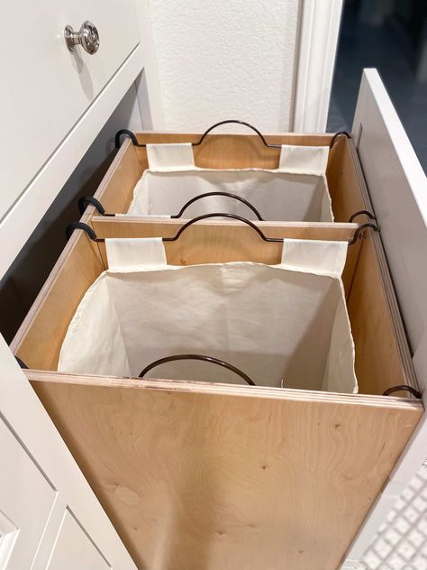 Our hidden laundry hamper is one of the most genius things we did! We walk you through each step of this double pull out laundry hamper that's made our lives easier! #hiddenhamperideas #hiddenlaundryhampercloset #laundryhamperideassmallspace #laundryhamperpulloutdrawer #clotheshamperideas #builtinlaundryhamper #doublelaundryhamperideas #doublepulloutlaundryhamper #doublehamperlaundrybaskets #pulloutlaundryhamperdrawers #ideasforhamperslaundrysorting #slideoutlaundryhamper #verticalhamper Pull Out Hamper Cabinet, Clothes Hamper Ideas, Hidden Hamper, Hidden Laundry Hamper, Pull Out Hamper, Laundry Room Hamper, Bathroom Hampers, Laundry Hamper Cabinet, Hamper Cabinet