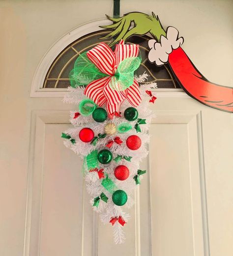 Dollar Tree Crafts & DIY with Instructions! + Freebies! 🥳 | The Grinch's hand I bought from Amazon, the other elements are from Dollar Tree, I put two white trees together to make it look better | Facebook Dollar Tree Grinch, Dollar Tree Crafts Diy, Grinch Tree, Grinch Hands, Grinch Christmas Tree, White Trees, Door Swag, White Tree, Grinch Christmas