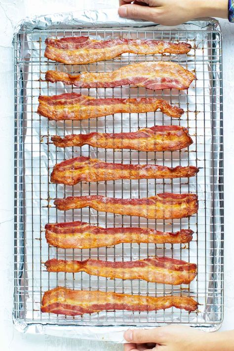 You'll always get the BEST and CRISPIEST results once you know How to Cook Bacon in the Oven! This foolproof method uses a wire rack for even baking and foil for quick and easy cleanup. Both pork and turkey bacon will turn out perfect every time! Bacon In Oven, Perfect Bacon, Oven Baked Bacon, Bacon In The Oven, Bacon Recipe, Cooking Bacon, Best Oven, Baked Bacon, Bacon Recipes