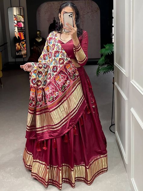 Get ready to turn heads and make a statement with our Spectacular Maroon Gaji Silk Lehenga Choli With Printed Dupatta. Ideal for weddings, mehendi functions, and ceremonies, this exquisite attire is sure to be the talk of the town. Crafted from premium quality gaji silk material, this maroon lehenga is designed with dyeing lagdi patti and features a cancan attached and micro cotton inner material, adding volume and movement to your every step. The lehenga has a 3.40-meter flair and is 41 inches Patola Dupatta Salwar Suits, Patola Dupatta With Lehenga, Lagdi Patta Dupatta, Gaji Silk Dupatta, Patola Lehenga, Marron Color, Tassels Dupatta, Rajasthani Lehenga, Plain Lehenga