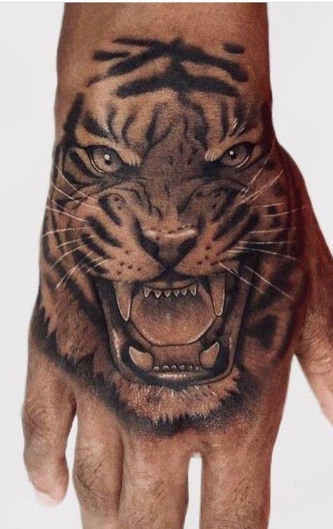 Tiger Tattoo In Hand, Tiger On Hand Tattoo Design, Tiger Hand Tattoo Design, Tiger Elbow Tattoo, Tiger On Hand Tattoo, Hand Lion Tattoo Design, Tiger Hand Tattoo Men, Tiger Tattoo Face, Lion Tattoo Hand