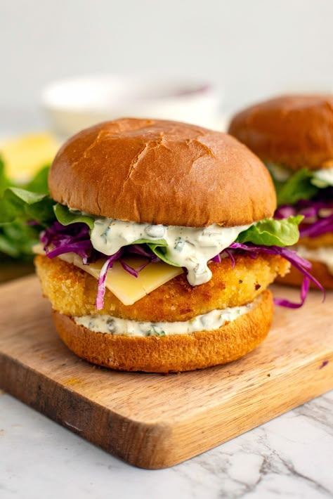 Want to learn how to make the best fish sandwich recipe? Or, as we call it in Australia, the good old fish burger. This recipe will walk you through every stage of the recipe: making the crispy fish patties, the tantalising tartar sauce, the tangy slaw and assembling it all on soft brioche buns. I got you covered with step-by-step photos, tips and variations, so you feel confident to make a dish your friends and family will be asking for again and again. Fish Burger Recipe, Fish Sandwich Recipes, Fish Patties, Pickled Red Cabbage, Red Cabbage Slaw, Recipes Fish, Fish Burger, Fish Sandwich, Tartar Sauce