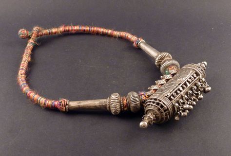 This is a big old Rajasthan silver amulet necklace, with a central pendant, and other old rajasthani silver beads. Quality of silver is high. Vintage Ceremonial Jewelry With Silver Beads, Ceremonial Silver Kundan Bracelets, Luxury Traditional Antique Silver Bracelet, Heavy Bohemian Bangle In Antique Silver, Traditional Hand-strung Silver Beads, Gold Jhumka Earrings, Gold Jewelry Outfits, Oxidised Silver Jewelry, Indian Jewelry Earrings