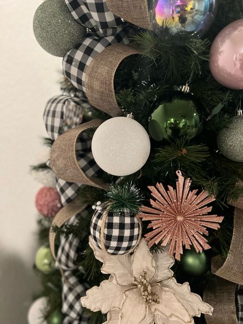 I wanted to add a little pink hue this year but still keep my farmhouse, buffalo check. Turned out great actually. Sime burlap and green sprinkled in there as well. Sage Green And Pink Christmas Tree, Pink Ornaments On Green Christmas Tree, Rose Gold And Burlap Christmas Tree, Pink Xmas Tree With Green Ornaments, Green And Pink Christmas Tree, Green Tree Pink Ornaments, Farmhouse Chrustmas Tree Ribbon, Rose Christmas Tree, Rosé Christmas