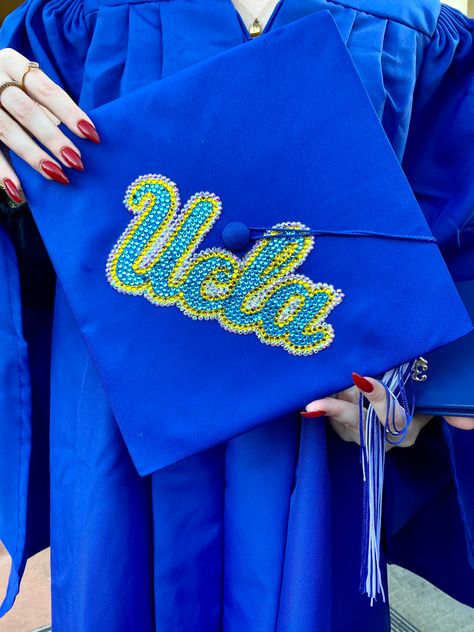 #uclagradcap #graduationcapdesigns #gradcap #gradcapinspo #gradcapideas #graduationcap #graduationcapdesigns #uclacap #motorboarddesigns #graduation #highschoolgraduation #stonedgradcap #stones #crystals #ucla Ucla Grad Cap, Grad Cap Designs, Graduation Cap Designs, Cap Designs, Grad Cap, High School Graduation, Graduation Cap, Vision Board, Crystals