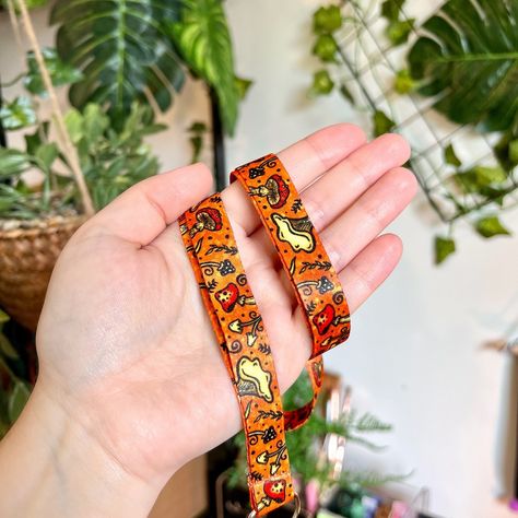 ✨ Our first lanyards! ✨ I still can’t believe my first six lanyard designs are finally out in the world! I really wasn’t sure how they would go as I’d never done an accessory like this before. There’s also a design for every mood I feel like! They’ve done better than I thought in the summer launch which I’m pleased about! I also sold some at StationeryFest which was great. I’d say the most popular design is the Botanic one so far but Froggish is a close second! 🌿 Are you a lanyard user? #... Mushroom Lanyard, Frog Art, Free Art Prints, Pin Art, Color Profile, Dye Sublimation, Nyx, Accessories Earrings, Lobster Claw