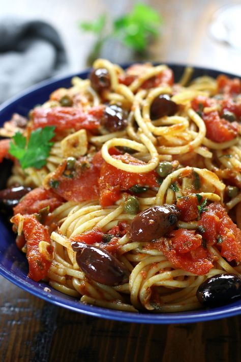 Spaghetti alla Puttanesca is an incredibly simple dinner that is perfect for busy weeknights. This authentic Italian recipe has delicious flavors of garlic, capers, anchovies, olives and tomatoes. Pasta lovers adore this recipe! #Puttanesca #SpaghettiPuttanesca #AuthenticItalianPasta https://www.thefedupfoodie.com Authentic Italian Pasta Recipes, Pasta Puttanesca Recipe, Italian Pasta Recipes Authentic, Authentic Italian Pasta, Spaghetti Alla Puttanesca, Puttanesca Sauce, Alla Puttanesca, Pasta Puttanesca, Pasta Alla Norma