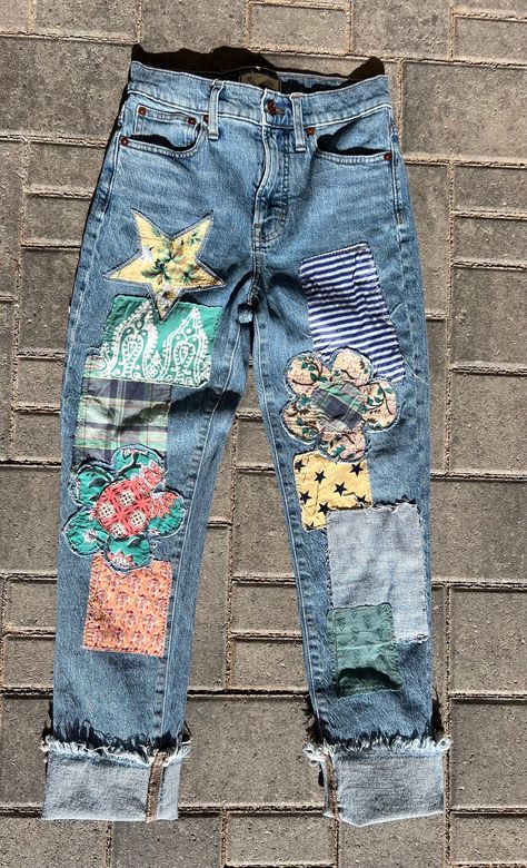 For my petite girlies!   These super cute Patched BoHo pants are perfect for streetwear, concerts,  festivals, or any time. There are assorted patches on the front created by embellishing with various thrifted fabrics. The hem is raw and can be cut shorter or cuffed.   Pair them with a solid top, sandals or your fave converse and you're good to go. If you need them to be cut just message me your inseam and I will cut them for you. Waist  27 inches Rise 11 inches Inseam 29  inches  hips 36 inches Thigh 20 inches  ankle  13" stretch - slight Rise is the most important measurement, as it determines where all the other measurements will fall. Please compare these measurements to your best fitting jeans to ensure a perfect fit as returns are very costly. Patched Pants, Altering Jeans, Redo Clothes, Ropa Upcycling, Hippie Jeans, Patch Pants, Diy Denim Jacket, Distressed Pants, Sewing Jeans