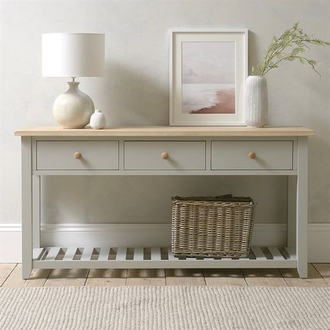 We could all do with somewhere to keep all that leaving-the-house-stuff we always end up rushing around trying to find in the morning. A console table is the answer. And not only will it help you stay organised and save time – this one from our ever-so-smart Chester Dove Grey range will be a handsome addition to your hallway too. The sturdy top has been waxed and lacquered to bring out its characterful grain and contrasts beautifully with the grey paint finish on the frame and handy lower shelf. Grey Console Table, Large Console Table, Oak Console Table, Console Table With Drawers, Wooden Console Table, Small Sideboard, Furniture Update, Grey Paint, Hallway Storage