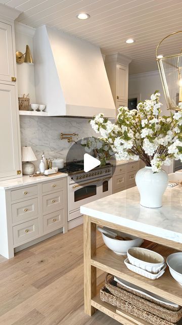 Chelsey Hale Design on Instagram: "A new kitchen with so many favorite design elements:  -calacatta marble countertops and backsplash  -Italian stove  -unlacquered brass hardware and plumbing  -plaster hood  -white oak island and wood floors  -creamy white cabinets in BM Edgecomb Gray   #kitchendesigns #interiordesignerslife #kitchendecorating" Kitchen Island Light Wood, Island With Shelf On End, Kitchen Backsplash With Creamy White Cabinets, Plaster Hood Kitchen With Cabinets, Calacatta Vagli Marble Kitchen, Kitchen White Oak Floors, Calacatta Marble Countertops, Marble Shelves Kitchen, Range Hood With No Upper Cabinets