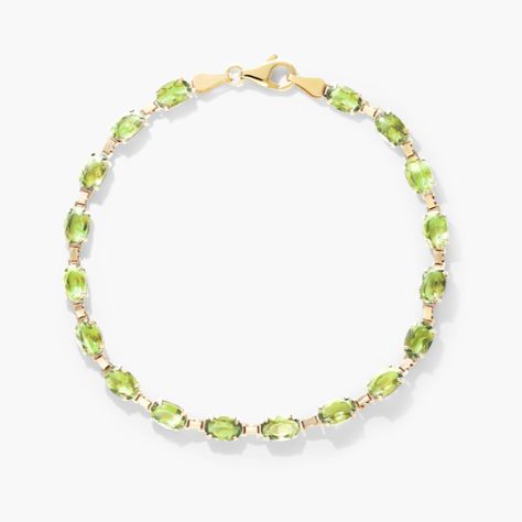 Colorful oval peridot are aligned and tastefully set in yellow gold to create this vibrant line bracelet. Flexible and light, it is perfect to bring the pop of color you need. Peridot Bracelet, Bracelet For Her, Yellow Sapphire Rings, Classic Wedding Rings, Platinum Wedding Rings, Peridot Stone, Clasp Bracelet, August Birthstone, Wedding Jewelry Bracelets