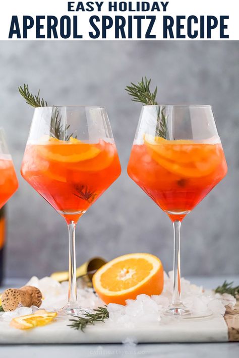 This festive Holiday Aperol Spritz is the ultimate light cocktail to enjoy during the holidays. Made with tart cranberry juice, Aperol, bubbly Prosecco, orange slice and sparkling water for the perfect refreshing sip. #holidaycocktail #holidaydrinks #cocktailrecipe #holidayparty #christmasdrinks #christmascocktails #holidayrecipes #aperolspritz Spritz Cocktails, Pom Juice, Sparkling Wine Cocktails, Aperol Spritz Recipe, Light Cocktails, Friendsgiving Food, Spritz Recipe, Cranberry Juice Cocktail, Orange Cocktails