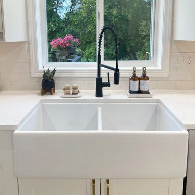 Sometimes a little order can bring things back into balance. The Austen double bowl farmhouse fireclay kitchen sink helps you organize the clean from the dirty by making space for washing and drying dishes at the same time. Our ultra-durable and dense fireclay is fired up to 2100° F and protected with our proprietary finish that safeguards and adds strength. Sinkology Size: 10" H x 36" L x 18" W | Sinkology Austen Fireclay Double Bowl Farmhouse Apron Front Undermount Kitchen Sink & Drain 10.0 H White Farmhouse Sink With White Cabinets, Divided Farmhouse Sink, Double Apron Sink, White Shaker Kitchen Cabinets Farmhouse, Farmhouse Kitchen Sink Ideas, Double Sink Kitchen, White Farm Sink, Double Farmhouse Sink, Kitchen Sink White