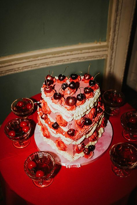 Valentine's Day Inspiration Editorial Shoot from Lisa Devlin at Photography Farm with pink and red heart-shaped wedding cake covered in fancy vintage style icing and cherries Photography @devlinphotos Creative Direction & Hair @bytiel Pink And Red Wedding Cake, Cherries Photography, Red Wedding Cake, Heart Shaped Wedding Cakes, Cake Photoshoot, Editorial Photoshoot, Indie Wedding, Heart Shaped Cakes, Valentines Day Cakes