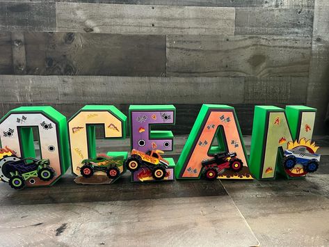 Trucks Centerpieces! And some more 3d letters! #susweetcraft #monstertruckparty #monstertruckcake #monsterjamparty #monstertruckdecorations #caketopper #3dletter #partydecor #partyideas #partykids #photoprops #cumpleañosinfantiles #celebracionesespeciales #fiestasinfantiles #centerpieces Monster Jam Party, Monster Truck Theme, Monster Truck Cake, Monster Truck Party, Truck Theme, 3d Letters, Monster Truck, Wooden Letters, Kids Party