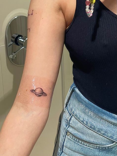 saturn tattoo planet space Saturn Aquarius Tattoo, Saturn Planet Tattoo, Saturn And The Moon Tattoo, Cute Saturn Tattoos, Small Saturn Tattoo, Saturn Tattoo Minimalist, Small Planet Tattoo, Tattoo Planet, Moon And Saturn Tattoo Taylor Swift