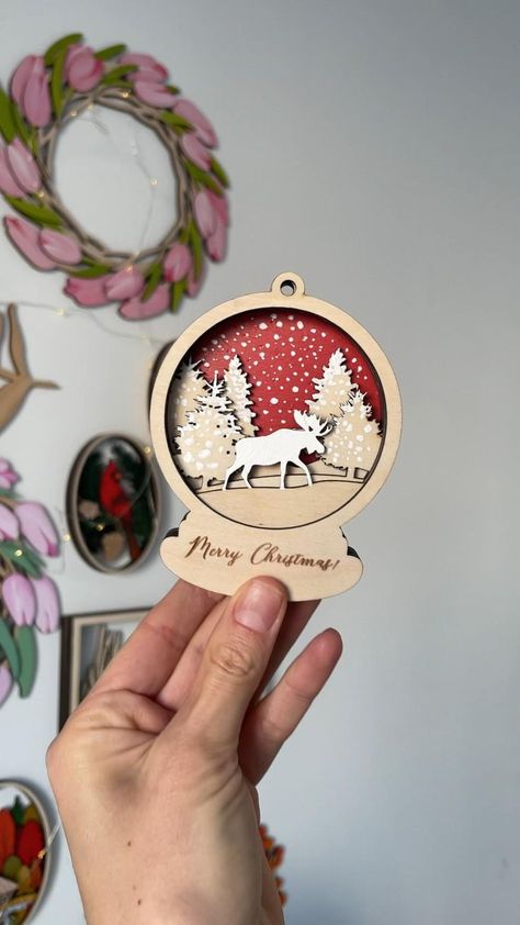 Dive into exciting CNC projects perfect for creating stunning wooden crafts this holiday season. Explore lantern designs, woodworking tutorials, and items ideal for selling at craft fairs! Diy Laser Engraver, Snow Globe Ornament, Deer Toy, Cut Crafts, Silhouette Design Files, Laser Cut Decor, Deer Svg, Woodworking Tutorials, Lantern Designs