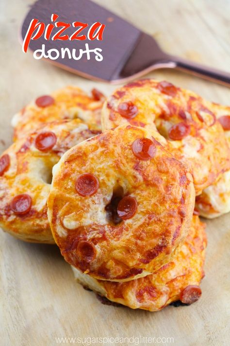 A fun pizza night recipe, these Pizza Donuts are simple enough for kids to make and a fun party recipe everyone will love! Pizza Donut Recipe Every Friday is family night in our house. Whether we’re doing a night of crafts, or board games – or a fun themed movie night – no matter what, … Pizza Donut Recipe, Donut Pan Recipe, Savory Donuts, Pizza Donuts, Donut Theme Party, Pizza Slider, Doughnut Party, Kids Pizza, Donut Themed Birthday Party