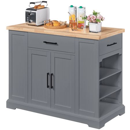 Kitchen trolley carts offer extra space for food preparation which is of great significance for small kitchens. This utility kitchen storage cabinet is made from CARB P2-compliant engineered wood base and a 3.5 cm thick rubber wood desktop, which boasts excellent sturdiness and durability. The kitchen island trolley includes a wide desktop, a big drawer, 2 side drawers, a double-door cabinet, and 2 side open-shelf cabinets, providing super-large storage space for all the essentials. The kitchen organizer can hold up to 230 kg / 507 lb in total, and the maximum load capacity of the counter space is 80 kg / 176 lb. Most importantly, this contemporary kitchen storage unit sits on 4 hidden casters at the bottom that offer effortless maneuverability for a totally concealed look. It can go anywh Portable Island For Kitchen, Small Island With Seating, Rolling Island Kitchen, Free Standing Kitchen Island, Korean Bapsang, Kitchen Island With Drawers, Utility Kitchen, Kitchen Carts On Wheels, Kitchen Island Trolley