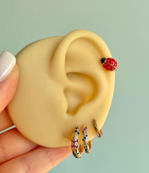 With these ladybug piercings, may luck and beauty always be with you! 🍀🐞#earrings #accesories #etsyshop #jewellery #aihoop #earcuffdesign #trendyjewellery Dream Jewelry, Lady Bug, Always Be, Ear Piercings, Ear Cuff, Piercings, Etsy Shop, On Instagram, Beauty