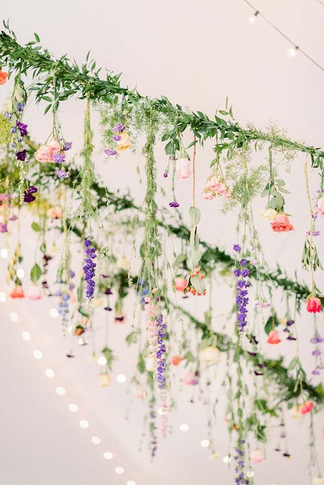 Hanging Wedding Flowers: A Whimsical Garden Wedding: Carly & Mark Greenery Garden Wedding, Hanging Flowers For Wedding, Hanging Flowers From Trees, Whimsical Garden Reception, Garden Party Hanging Flowers, Garden Party Flowers Decoration, Wildflower Whimsical Wedding, Wildflower Hanging Garland, Garden Wedding Inside