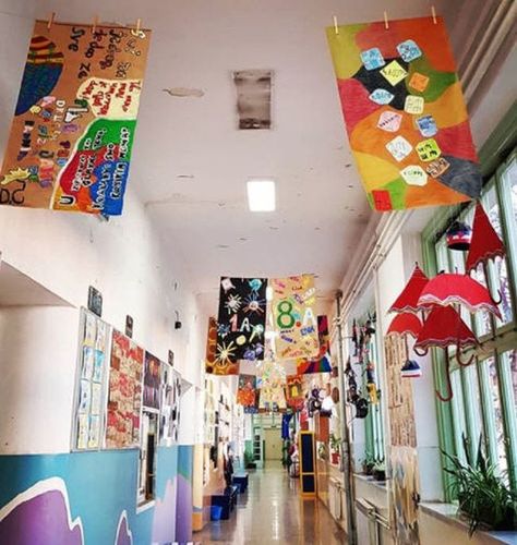 25 Wonderful Ways To Make School Hallways Positive and Inspiring Kindness Hallway Display, Hanging Art In School Hallway, Painting School Walls, School Staircase Decorations, Displaying Art In School Hallway, Welcome Back To School Hallway Decor, Front Office School Decor, School Hallway Themes Ideas, School Orientation Decoration Ideas