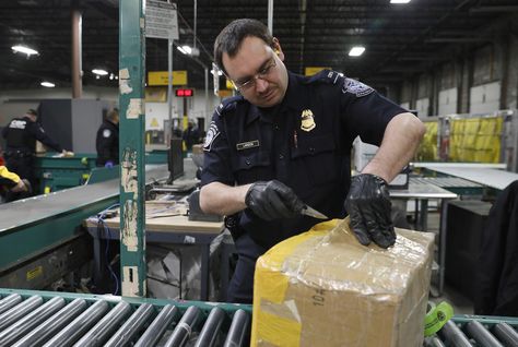 Officers with U.S. Customs and Border Protection, Office of Field Operations, screen packages for counterfeit products being shipped into the area as they participate in security operations leading up Super Bowl LII in Minneapolis, Minn., Jan. 29, 2018. U.S. Customs and Border Protection photo by Glenn Fawcett Moving House Packing, Chase Bank Account, Louise Jones, Cross Drawing, Security Office, Delivery Pictures, Credit Card App, Airbnb Promotion, Chase Bank