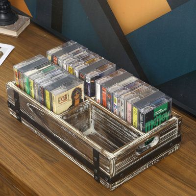 This rustic torchwood storage box is perfect for retro music lovers who want to display and store their vintage collection of cassette tapes. Categorize or organize your collection the way you want with four separated compartments. The side handles allow you to carry your collection anywhere easily. The box will keep your vintage cassette collection neatly organized while perfectly complementing the various style of home decor. | Gracie Oaks 4 Slot Cassette Tape Media Storage Wood Box Brown 12.5 Cassette Display Ideas, Cassette Tape Display, Cassette Tape Collection, Vintage Storage Boxes, Cassette Organizer, Room Organization Ideas Bedroom, Cassette Collection, Box Decoration Ideas, Organization Tray