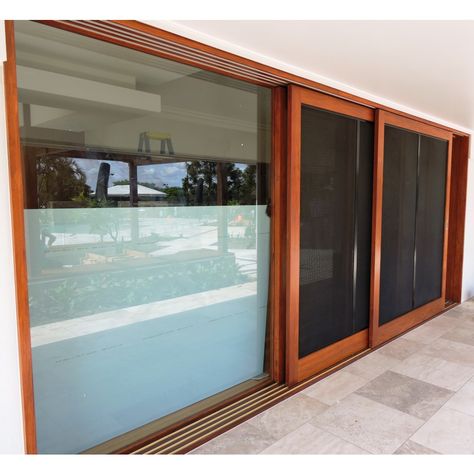 Timber sliding doors with sliding screen doors // www.Allkind.com.au Sky Frame Sliding Doors, Window Security Screens, Sliding Asian Door, Skyframe Sliding Doors, Timber Sliding Window Screen, Sliding Screen Doors All About Doors & Windows, Wooden Window Design, Timber Sliding Doors, Sliding Screen Doors