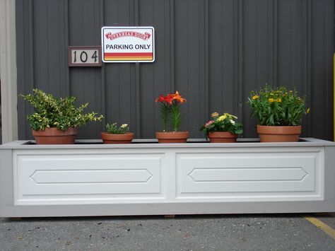 We made a set of matching planters out of an old wood garage door from the 50's Repurpose Garage, Garage Doors Diy, Garage Door Wood, Louvered Bifold Doors, Door Panel Ideas, Garage Arbor, Homemade Photo Frames, Old Garage Door, Do It Yourself Garage