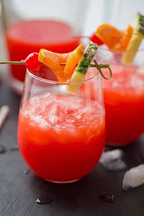 This rum punch recipe is going to make you feel like you are on vacation with every sip! Throw your cares away, sit back, relax and enjoy this simple rum punch recipe! Caribbean Rum Punch Recipe, Summer Punch Recipes, Rum Punch Recipe, Rum Punch Recipes, Party Punch Recipes, Alcoholic Punch, Caribbean Rum, Punch Recipe, Rum Punch