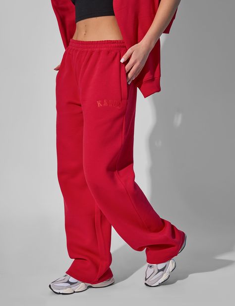 Introducing the Kaiia Wide Leg Sweat Pants in Red - the perfect combination of off the runway style and casual comfort. These sweat pants are made from high-quality materials that are soft to the touch and perfect for lounging or running errands. The wide leg design adds a touch of sophistication to this classic piece, making it a versatile addition to your wardrobe. Whether you're going out or staying in, the Kaiia Wide Leg Sweat Pants in Red will keep you looking chic and feeling comfortable. Wide Leg Sweat Pants, Red Sweatpants, Red Joggers, Public Desire Shoes, Wide Leg Joggers, Harry Potter Outfits, Leg Design, Sweat Pants, Red Hoodie