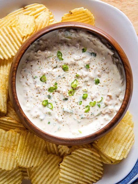 This easy clam dip recipe is creamy, savory, and packed with flavor. You only need four ingredients to make it: canned clams, cream cheese, Worcestershire sauce and scallions. Serve it with crackers or vegetables. It’s the perfect holiday appetizer.  This clam dip is a Thanksgiving staple at my friend’s house. Every year, she makes at...Read More Bread Machine Sandwich Bread, Easy Apple Galette Recipe, Clam Dip Recipe, Canned Clams, Bread Bowl Dip, Clam Dip, Pumpkin Pancakes Easy, Spinach Puff Pastry, Spinach Puff