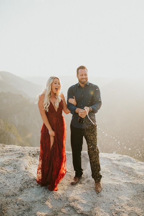 Engagement Photos Burgundy Dress, Couples Photos Red Dress, Engagement Dress Fall, Flowy Engagement Photo Dress, Burgundy Engagement Pictures Outfit, Engagement Photos Dress Outfits, Red Dress Couple Photoshoot, Red Dress Engagement Pictures, Engagement Photos Red Dress