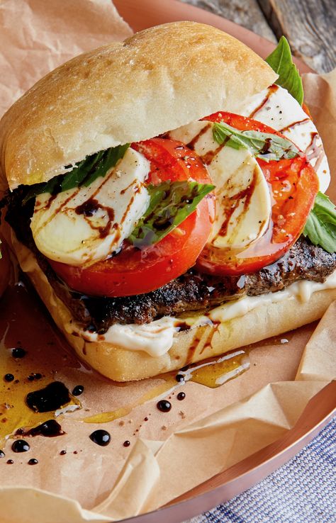 The recipe takes the classic Caprese salad and sticks it between two ciabatta buns on top of ground beef chuck for a delicious and satisfying Caprese burger. In just under 15 minutes, you can create this delightful American mash-up for a meal the whole family will love. Chuck Beef Recipes, Caprese Burger, Caprese Recipes, Dinner This Week, Beef Chuck, Week Meal Plan, Caprese Salad, Soup And Salad, Salmon Burgers