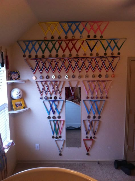 Medal wall from all of my gymnastics medals my dad created for me! Trophy Display Ideas, Gymnastics Room Decor, Gymnastics Medal Display, Gymnastics Bedroom, Gymnastics Decor, Medal Display Ideas, Hanging Medals, Medals Display, Gymnastics Medals