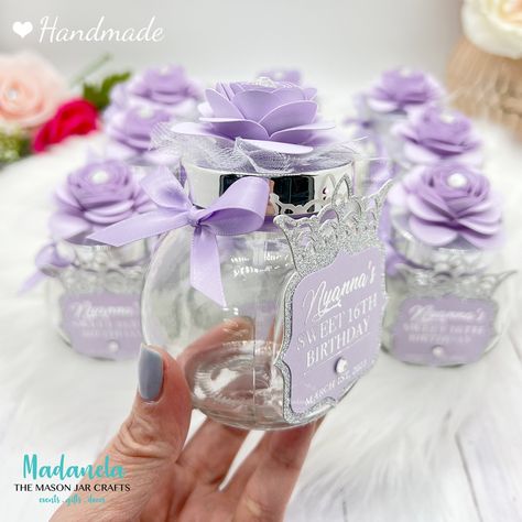 Set of 10 clear glass candy jar favors-5oz. Decorated with paper flowers, rhinestones, and a princess tag. Perfect for candy favors, wedding favors, baby shower favor, and quinceanera favor. Fill these with chocolates, kisses, and small candies, and impress your guests with these delicate, personalized candy jars. You can also fill them with seashells, sand, coffee, tea bags, or spices.  JARS ARE MAILED COMPLETELY ASSEMBLED, READY TO ADD CANDY Hand made item Materials: Glass jar, paper, ribbon 5 Dollar Tree Favor Ideas, Quinceanera Party Favors Ideas, Quinceanera Favors For Guests, Quince Party Favors, Mason Jar Party Favor, Personalized Candy Jars, Sweet Sixteen Party Favors, Sweet 16 Candy, Quinceanera Party Favors