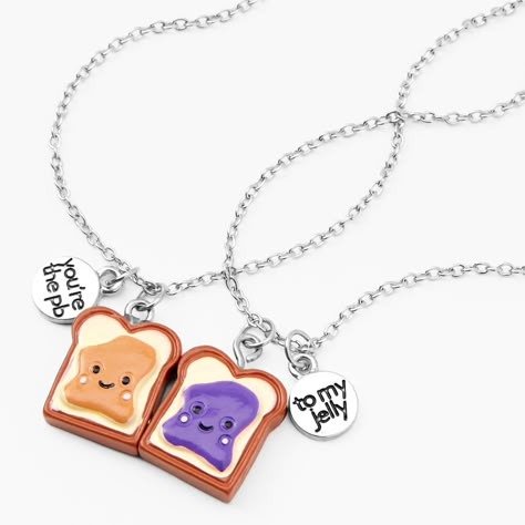 Find me a better duo. Show your love & admiration for your BFF with this pack of 2, dainty silver-tone necklaces, each equipped with a smothered slice! Slices of PB&J make up the design of this best friends pendant necklace set. Dangling next to each pendant, are silver-tone charms that read "You're the PB" "To my jelly" in whimsy lettering. Near or far, take a piece of your bestie wherever you may snack. Ideal for birthdays, or "just because" - gift this delicious friendship piece to th Best Friend Things Matching, Cute Bff Necklaces For 2, Stitch Bff Necklace, Friendship Necklaces For 2 Friends, Bff Necklaces For 2 Best Friends, Cute Bff Jewelry, Bff Necklaces For 2 Magnetic, Friend Necklaces For 2, Best Friend Necklaces For 2 Unique