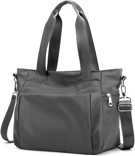 Absolutely the best bag there is for moms! Roomy yet stylish. Carry as a shoulder bag or crossbody. Loads of pockets for organization! An absolute must-have! Travel Messenger Bag, Laptop Handbag, Nylon Tote Bag, Daypack Backpack, Utility Tote, Trendy Shoulder Bag, Nylon Tote Bags, Nylon Tote, Black Tote