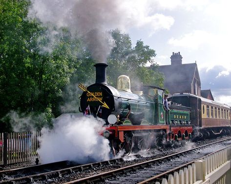 Golden Arrow Bluebell Railway, Sheffield Park-East Grinstead, East Sussex, England, departs from Sheffield Park station near Uckfield, East Sussex. Pullman cars and a first-class dining carriage travel under steam through the fields and woodlands of the Sussex Weald, reaching East Grinstead before returning to the Sheffield Park hub. The journey lasts about three and a half hours. Bluebell Railway, Pullman Car, Golden Arrow, East Grinstead, Sussex England, Train Journey, East Sussex, East West, Sheffield