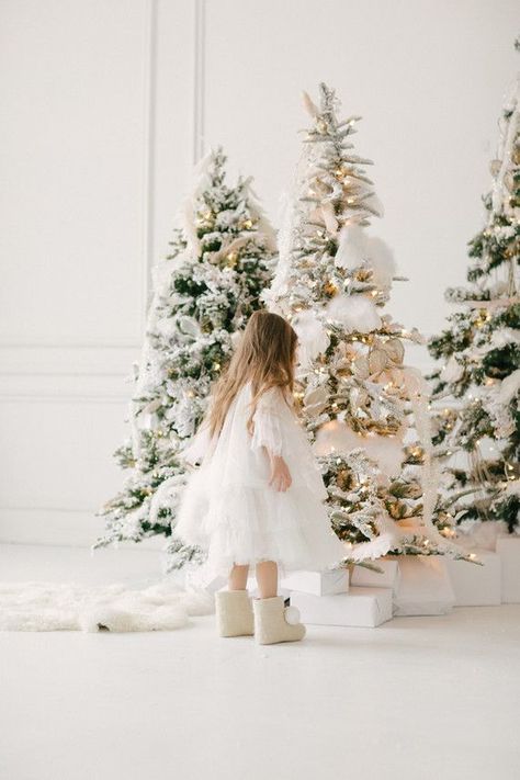 White and gold Christmas wonderland shoot | 100 Layer Cakelet | Bloglovin’ White Christmas Set Photography, White Christmas Photography, Christmas Decor Ideas For Photoshoot, White Christmas Studio Photography, White Christmas Mini Sessions, Christmas Photo Decor, Christmas Minis Studio, White Christmas Photo Shoot Family, White Christmas Family Photoshoot