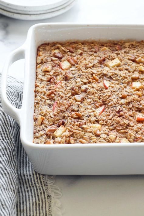 Filled with chewy oats, tender apple chunks, warm cinnamon, and toasted walnuts this Apple Cinnamon Baked Oatmeal is a delicious breakfast for kids and adults alike. Baked Oatmeal With Apples, Oatmeal With Apples, Apple Cinnamon Baked Oatmeal, Cinnamon Baked Oatmeal, Baked Apple Oatmeal, Real Food Dietitians, Paleo Muffins, Apple Cinnamon Oatmeal, Apple Breakfast