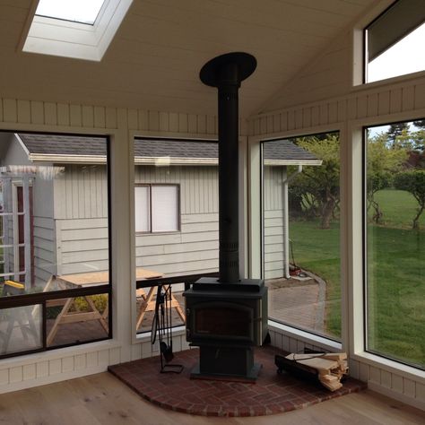 Wood Stove In Sunroom, Enclosed Porch With Wood Stove, 4 Season Room With Wood Stove, French Conservatory Interiors, Wood Burning Stove In Sunroom, Sunroom Wood Stove, 4 Season Porch With Wood Stove, Sunroom With Stove, Wood Burning Stove Sunroom