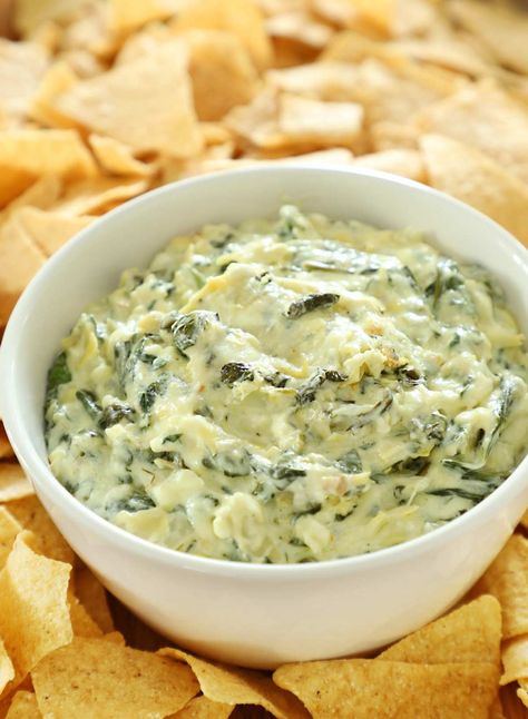 An easy baked spinach artichoke dip with feta. A one pan dip that is warm, creamy and cheesy with spinach, artichokes and feta. This dip is always a crowd pleaser. Baked Spinach Artichoke Dip, Baked Spinach, Spinach Artichoke Dip, Artichoke Dip, Spinach And Cheese, Spinach Artichoke, Artichoke Hearts, One Pan, Crowd Pleaser