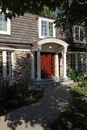 marnsard roof with arched windows in roof | love the updated mansard roof and arched entry. Exterior ... Entry Exterior, Arched Entry, Portico Design, House Victorian, Hamptons Decor, Mansard Roof, Porch Roof, Roof Architecture, Dutch Colonial