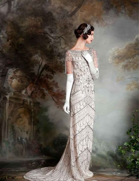 a romantic 1920s fully embellished wedding dress, with short fringed sleeves and tall gloves Vintage Dresses 1920's, Wedding Dresses Vintage 20s, Look Gatsby, Art Deco Wedding Dress, Deco Wedding Dress, 1920s Wedding Dress, Glam Wedding Dress, Embellished Wedding Dress, Eliza Jane