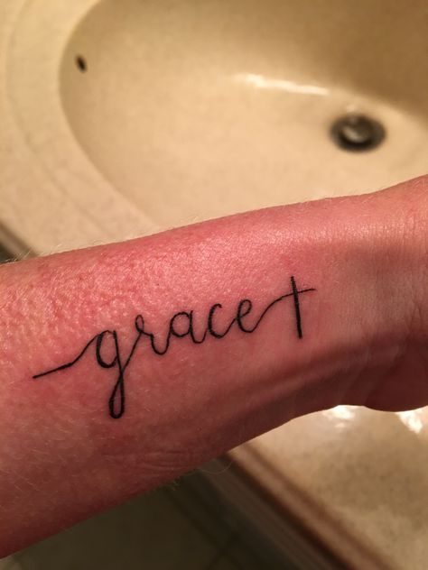 A simple grace tattoo with a cross at the end. Grace Tattoo, Simple Cross Tattoo, Grace Tattoos, Scripture Tattoos, Lotr Tattoo, Cross Tattoos For Women, Tattoo Prices, Cross Tattoo Designs, Wrist Tattoos For Women